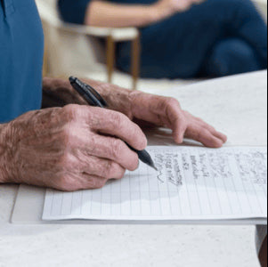 an air purifier in a doctors office lobby while a patient fills out forms