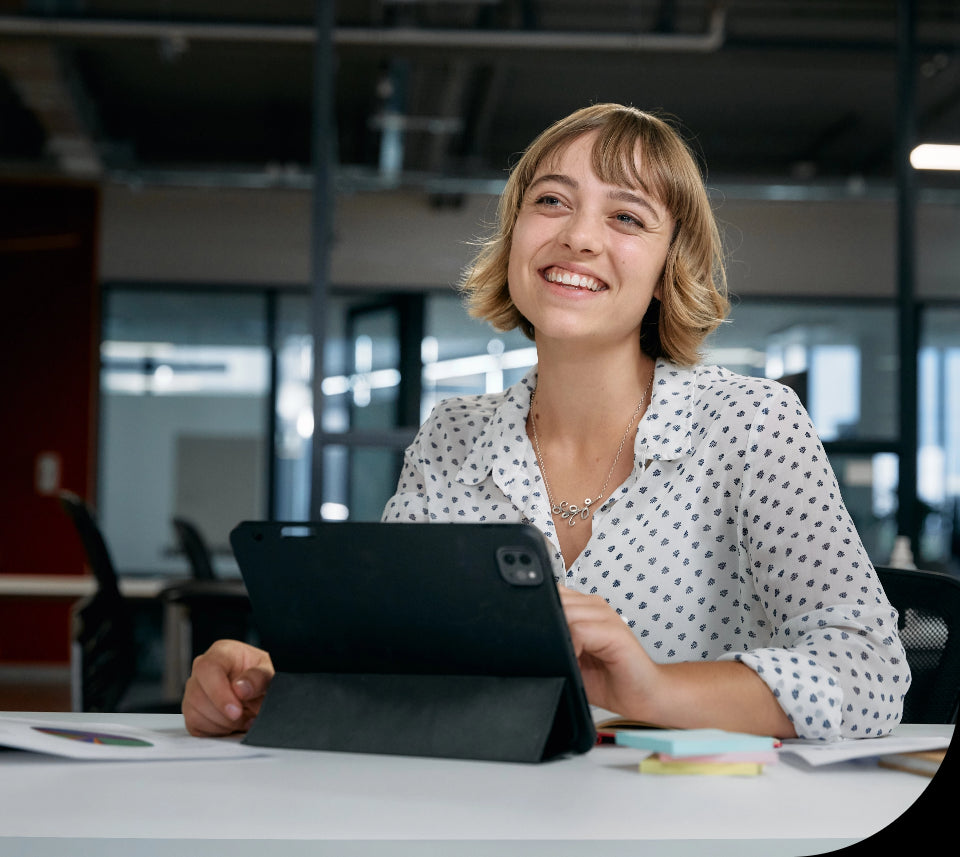 a lady working on a tablet in the public sector.