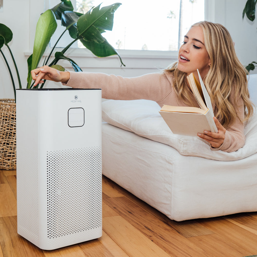 White rectangular ma-50-v3.0 air purifier with perforated front panel and minimalist control button on top