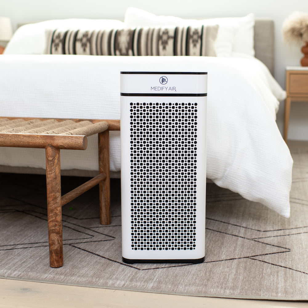 White rectangular medify air ma-40 air purifier with black perforated front panel for improved air filtration